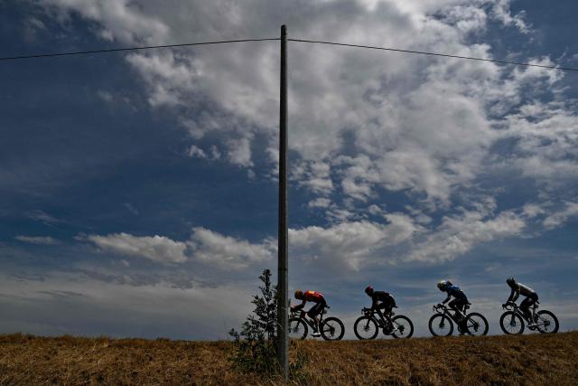 (From L) Uno-X Mobility team's Danish rider Anthon Charmig, Tudor Pro Cycling Team's French rider Julian Alaphilippe, Movistar Team's Portuguese rider Nelson Oliveira and TotalEnergies team's French rider Mathis Le Berre cycle in a breakaway during the 11th stage of the 113th edition of the Tour de France cycling race, 161,3 km between Vichy and Nevers in central France, on July 15, 2026. (Photo by Jeff PACHOUD / AFP)