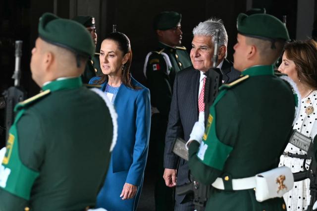Mexico's President Claudia Sheinbaum (L) welcomes Panama's President Jose Raul Mulino (C) and his wife Maricel Cohen (R) at the National Palace in Mexico City on July 15, 2026. (Photo by YURI CORTEZ / AFP)