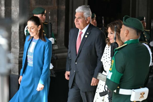 Mexico's President Claudia Sheinbaum (L) welcomes Panama's President Jose Raul Mulino (C) and his wife Maricel Cohen (R) at the National Palace in Mexico City on July 15, 2026. (Photo by YURI CORTEZ / AFP)