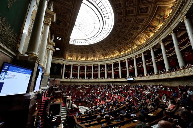 French MP's attend the voting session on the assisted dying bill at the National Assembly, France's lower house of parliament in Paris on July 15, 2026. France is set to move closer to joining the ranks of countries that guarantee the right to assisted dying, after the long journey to adoption of a controversial bill. (Photo by STEPHANE DE SAKUTIN / AFP)