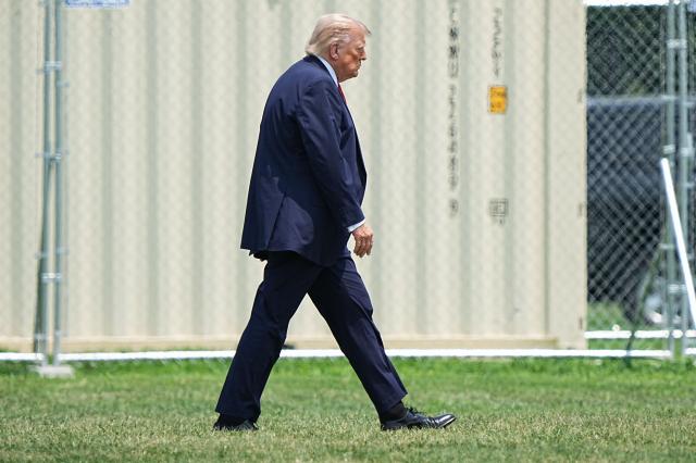 US President Donald Trump walks to Marine One as he departs from the Ellipse near the White House in Washington, DC, on July 15, 2026. President Trump is travelling to Carlisle, Pennsylania to attend the Pennsylvania Defense and Innovation Summit (Photo by Haiyun Jiang / POOL / AFP)
