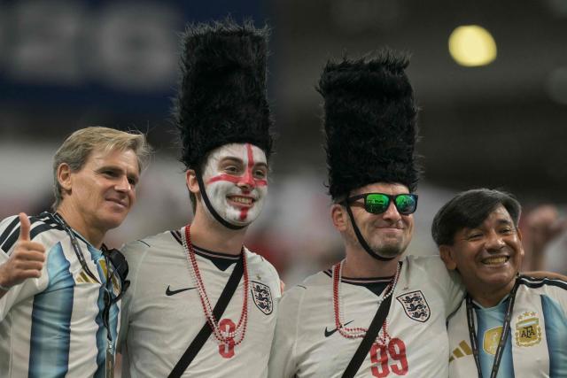 England and Argentina supporters pose in the stands ahead of the 2026 World Cup football tournament semi-final match between England and Argentina at the Atlanta Stadium in Atlanta on July 15, 2026.  (Photo by JUAN MABROMATA / AFP)