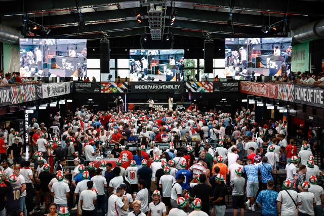 England supporters gather and wait for the start of a live broadcast of the 2026 World Cup semifinal football match between England and Argentina, at Boxpark Wembley in London on July 15, 2026. (Photo by Brook Mitchell / AFP)