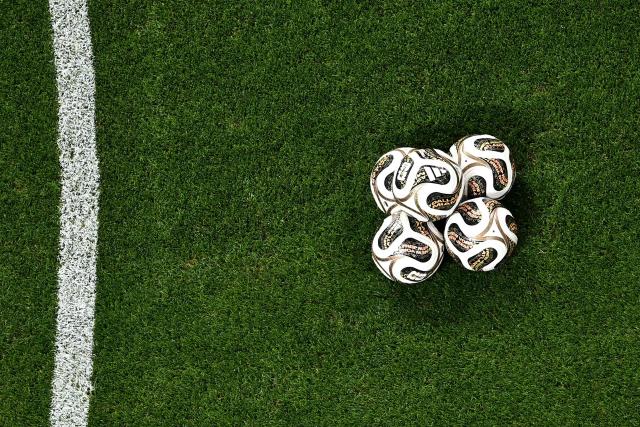 Balls are seen on the pitch ahead of the 2026 World Cup football tournament semi-final match between England and Argentina at the Atlanta Stadium in Atlanta on July 15, 2026.  (Photo by Jewel SAMAD / AFP)