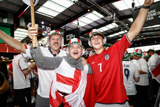 England supporters cheer before the start of a live broadcast of the 2026 World Cup semifinal football match between England and Argentina, at Boxpark Wembley in London on July 15, 2026. (Photo by Brook Mitchell / AFP)