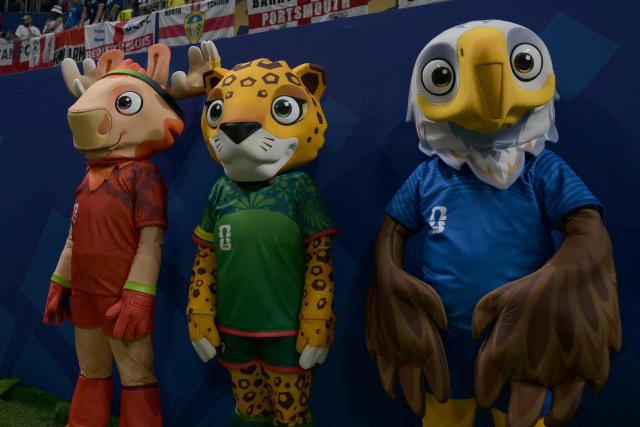 Mascots of 2026 World Cup, Maple the Moose representing Canada (L), Zayu the Jaguar representing Mexico (C) and Clutch the Bald Eagle representing the US (R), stand in the stadium ahead of the 2026 World Cup football tournament semi-final match between England and Argentina at the Atlanta Stadium in Atlanta on July 15, 2026.  (Photo by JUAN MABROMATA / AFP)