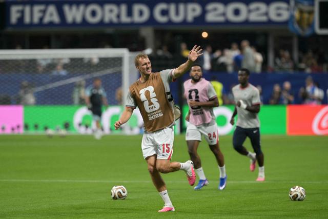 England's defender #15 Dan Burn (C) gestures as he warms up ahead of the 2026 World Cup football tournament semi-final match between England and Argentina at the Atlanta Stadium in Atlanta on July 15, 2026.  (Photo by JUAN MABROMATA / AFP)