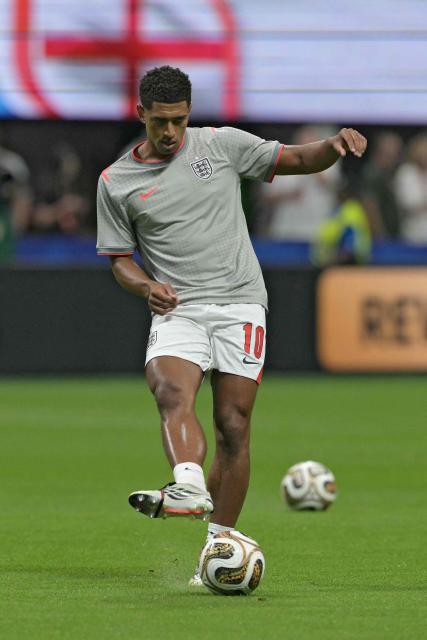 England's midfielder #10 Jude Bellingham kicks the ball during the warm up ahead of the 2026 World Cup football tournament semi-final match between England and Argentina at the Atlanta Stadium in Atlanta on July 15, 2026.  (Photo by JUAN MABROMATA / AFP)