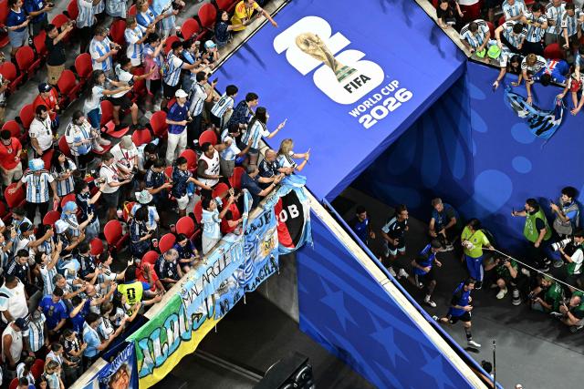 Argentina's forward #10 Lionel Messi (R) and teammates arrive on the pitch to warm up ahead of the 2026 World Cup football tournament semi-final match between England and Argentina at the Atlanta Stadium in Atlanta on July 15, 2026.  (Photo by Jewel SAMAD / AFP)