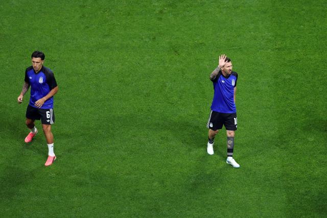 Argentina's forward #10 Lionel Messi waves next to Argentina's defender #06 Lisandro Martinez as he arrives on the pitch to warm up ahead of the 2026 World Cup football tournament semi-final match between England and Argentina at the Atlanta Stadium in Atlanta on July 15, 2026.  (Photo by PATRICIA DE MELO MOREIRA / AFP)