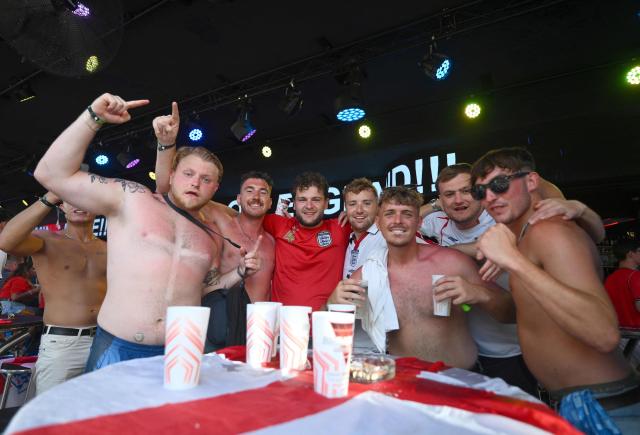 England's supporters cheer prior the 2026 World Cup semi-final match between England and Argentina on a giant screen in Benidorm, on Spain's eastern coast, on July 15, 2026. (Photo by JOSE JORDAN / AFP)