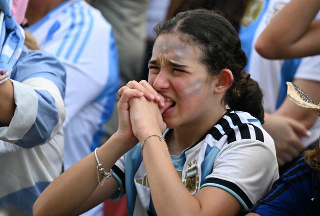 An Argentina fan reacts during a watch party for the 2026 World Cup semi-final match between England and Argentina in Miami Beach, Florida, on July 15, 2026. (Photo by CHANDAN KHANNA / AFP)