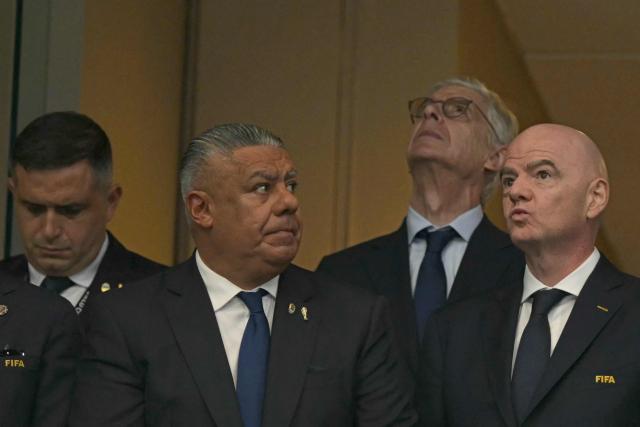 President of the Argentine Football Association Claudio Tapia (2L) and FIFA President Gianni Infantino (R) look on from the stands ahead of the 2026 World Cup football tournament semi-final match between England and Argentina at the Atlanta Stadium in Atlanta on July 15, 2026. (Photo by JUAN MABROMATA / AFP)