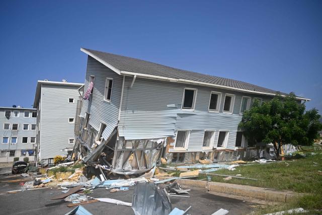 Buildings at the Urbanismo Comunidad Socialista Residencias Hugo Chavez are seen damaged in Catia La Mar, La Guaira state, Venezuela, on July 15, 2026, following the June 24 twin earthquakes. The death toll from the earthquakes that struck Venezuela almost three weeks ago has surpassed 4,700, while almost 17,000 people have been injured, an official report released on July 14, 2026 stated. (Photo by Juan BARRETO / AFP)