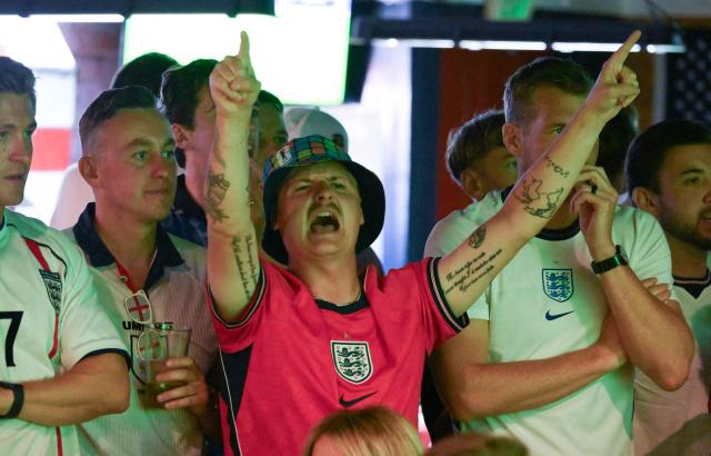 An England fan gestures while watching the 2026 World Cup semi-final match between England and Argentina at the Underground Pub & Grill in Hermosa Beach, California, on July 15, 2026. (Photo by Patrick T. Fallon / AFP)