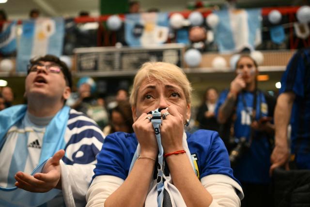 Fans of Argentina react as they watch the 2026 FIFA World Cup semi-final football match between England and Argentina, in Buenos Aires on July 15, 2026. (Photo by Luis ROBAYO / AFP)
