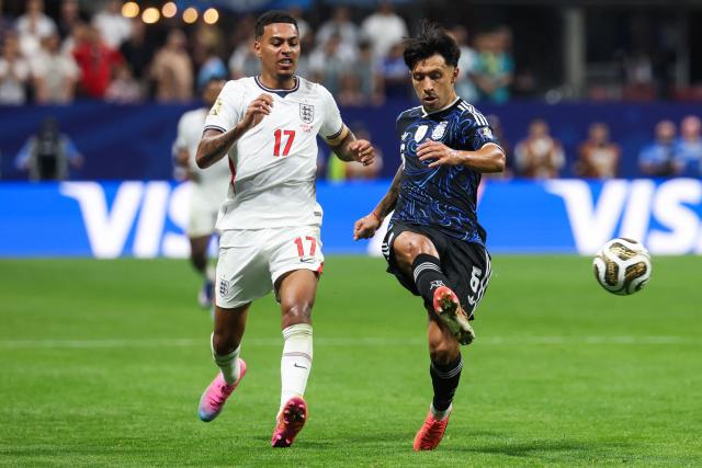 Argentina's defender #06 Lisandro Martinez (R) kicks the ball past England's midfielder #17 Morgan Rogers during the 2026 World Cup football tournament semi-final match between England and Argentina at the Atlanta Stadium in Atlanta on July 15, 2026.  (Photo by Odd ANDERSEN / AFP)