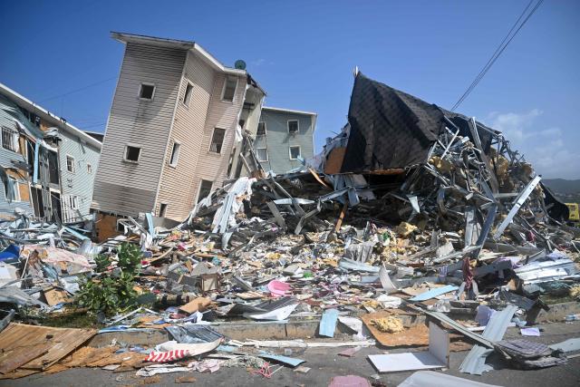 Buildings at the Urbanismo Comunidad Socialista Residencias Hugo Chavez are seen damaged in Catia La Mar, La Guaira state, Venezuela, on July 15, 2026, following the June 24 twin earthquakes. The death toll from the earthquakes that struck Venezuela almost three weeks ago has surpassed 4,700, while almost 17,000 people have been injured, an official report released on July 14, 2026 stated. (Photo by Juan BARRETO / AFP)