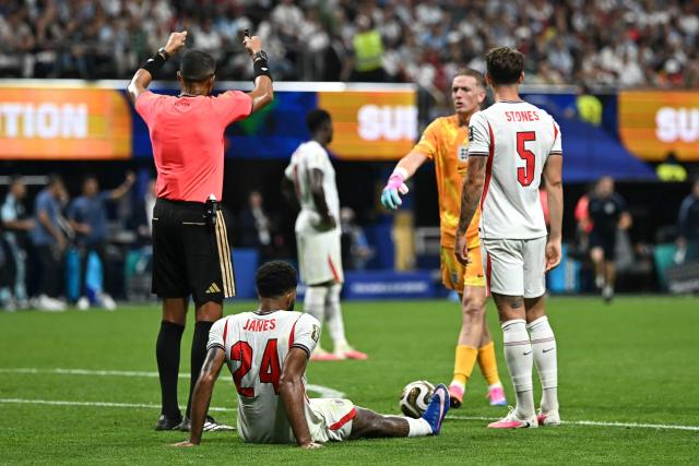 England's defender #24 Reece James sits on the pitch after picking up an injury during the 2026 World Cup football tournament semi-final match between England and Argentina at the Atlanta Stadium in Atlanta on July 15, 2026.  (Photo by Paul ELLIS / AFP)