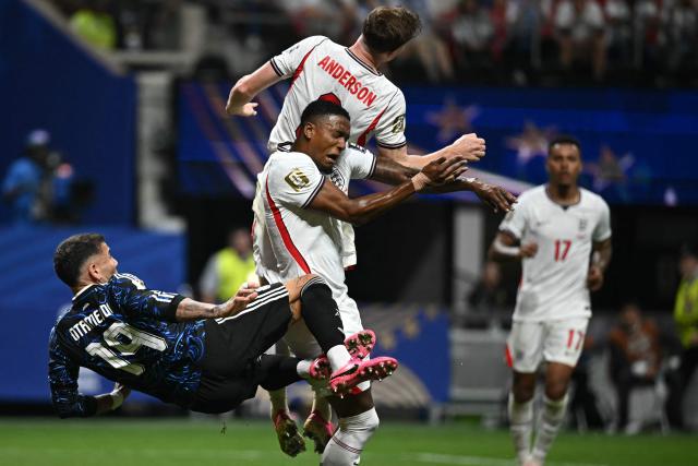 (From L) Argentina's defender #19 Nicolas Otamendi, England's defender #02 Ezri Konsa and England's midfielder #08 Elliot Anderson fight for the ball during the 2026 World Cup football tournament semi-final match between England and Argentina at the Atlanta Stadium in Atlanta on July 15, 2026.  (Photo by Paul ELLIS / AFP)