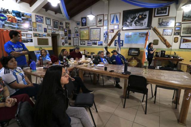 Malvinas (Falklands) war veterans and relatives watch the 2026 World Cup football semi-final match between Argentina and England on a giant screen in Buenos Aires on July 14, 2026. (Photo by Cristian Urrutia / AFP)
