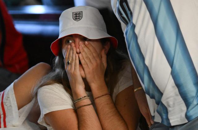 An England fan reacts to Argentina scoring their second goal while watching the 2026 World Cup semi-final match between England and Argentina at the Underground Pub & Grill in Hermosa Beach, California, on July 15, 2026. (Photo by Patrick T. Fallon / AFP)