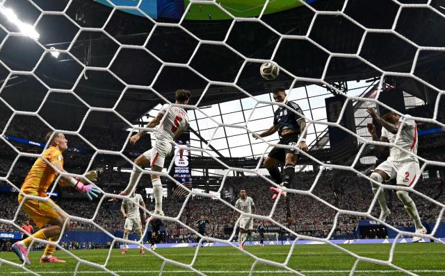 Argentina's forward #22 Lautaro Martinez scores his team's second goal during the 2026 World Cup football tournament semi-final match between England and Argentina at the Atlanta Stadium in Atlanta on July 15, 2026.  (Photo by Paul ELLIS / AFP)