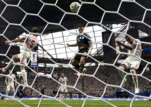 Argentina's forward #22 Lautaro Martinez scores his team's second goal during the 2026 World Cup football tournament semi-final match between England and Argentina at the Atlanta Stadium in Atlanta on July 15, 2026.  (Photo by Paul ELLIS / AFP)