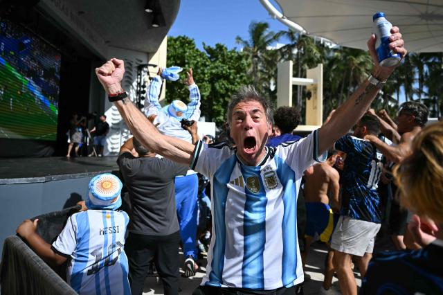 Argentina fans react to their team's second goal during a watch party for the 2026 World Cup semi-final match between England and Argentina in Miami Beach, Florida, on July 15, 2026. (Photo by CHANDAN KHANNA / AFP)