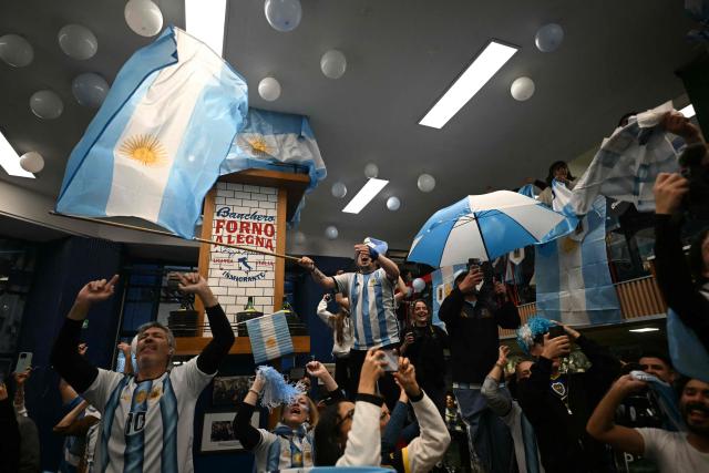 Fans of Argentina react as they watch the 2026 FIFA World Cup semi-final football match between England and Argentina, in Buenos Aires on July 15, 2026. (Photo by Luis ROBAYO / AFP)