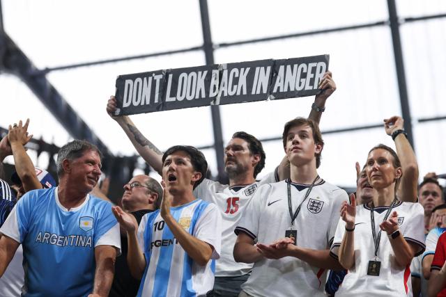 England fans cheer after losing the 2026 World Cup football tournament semi-final match between England and Argentina at the Atlanta Stadium in Atlanta on July 15, 2026.  (Photo by Odd ANDERSEN / AFP)