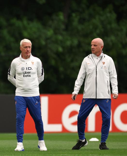France's head coach Didier Deschamps talks to his assistant coach Guy Stephan during a training session at Bentley University in Waltham, near Boston on July 15, 2026. (Photo by FRANCK FIFE / AFP)