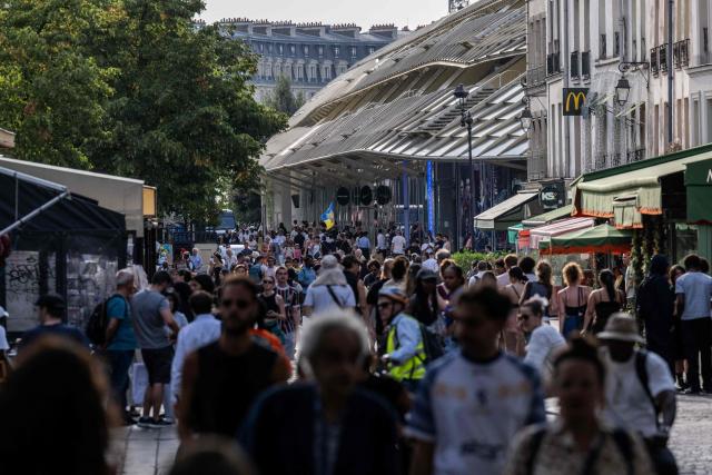 Pedestrians walk through the Chatelet Les Halles neighbourghood in central Paris on July 15, 2026. (Photo by Martin LELIEVRE / AFP)