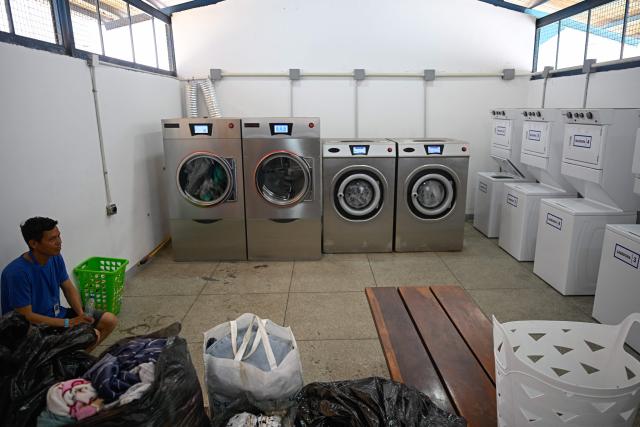 A view of a laundry area inside a temporary shelter camp for people displaced from La Guaira at the Jose Gervasio Artigas Educational Complex in Propatria, Caracas, on July 15, 2026, following the June 24 twin earthquakes. The death toll from the earthquakes that struck Venezuela almost three weeks ago has surpassed 4,700, while almost 17,000 people have been injured, an official report released on July 14, 2026 stated. (Photo by Federico PARRA / AFP)