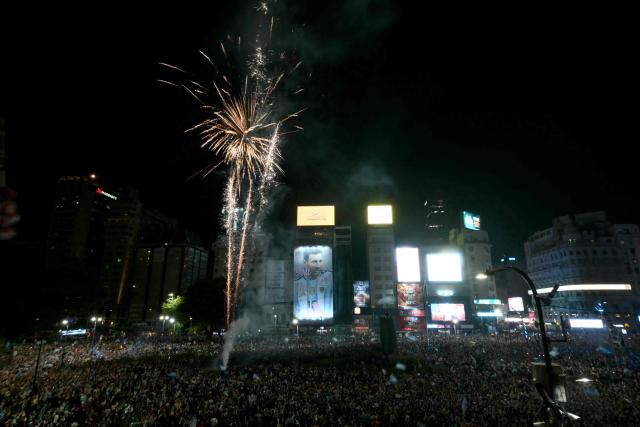 Fans celebrate Argentina's victory over England in the 2026 FIFA World Cup semi-final football match at the Obelisk in Buenos Aires on July 15, 2026. (Photo by Luis ROBAYO / AFP)
