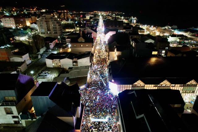 In this aerial view fans celebrate Argentina's victory over England in the 2026 FIFA World Cup semi-final football match in Ushuaia, Argentina on July 15, 2026. (Photo by Cristian Urrutia / AFP)