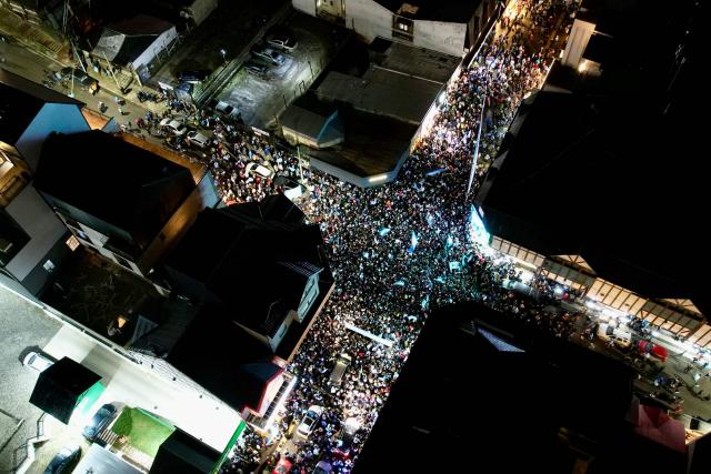 In this aerial view fans celebrate Argentina's victory over England in the 2026 FIFA World Cup semi-final football match in Ushuaia, Argentina on July 15, 2026. (Photo by Cristian Urrutia / AFP)