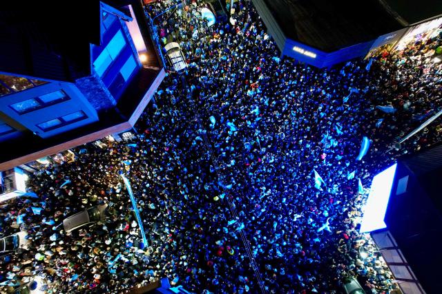 In this aerial view fans celebrate Argentina's victory over England in the 2026 FIFA World Cup semi-final football match in Ushuaia, Argentina on July 15, 2026. (Photo by Cristian Urrutia / AFP)