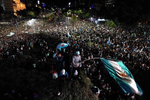 Fans celebrate Argentina's victory over England in the 2026 FIFA World Cup semi-final football match at the Obelisk in Buenos Aires on July 15, 2026. (Photo by Luis ROBAYO / AFP)