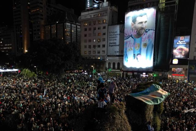 Fans celebrate Argentina's victory over England in the 2026 FIFA World Cup semi-final football match at the Obelisk in Buenos Aires on July 15, 2026. (Photo by Luis ROBAYO / AFP)