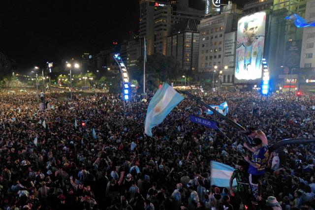 Fans celebrate Argentina's victory over England in the 2026 FIFA World Cup semi-final football match at the Obelisk in Buenos Aires on July 15, 2026. (Photo by Luis ROBAYO / AFP)