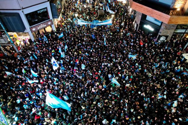 In this aerial view fans celebrate Argentina's victory over England in the 2026 FIFA World Cup semi-final football match in Ushuaia, southern Argentina, on July 15, 2026. (Photo by Cristian Urrutia / AFP)