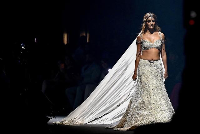 Bollywood actress Ananya Panday presents a creation by Indian designer Gaurav Gupta during the couture show in Mumbai on July 17, 2026. (Photo by Sujit JAISWAL / AFP)
