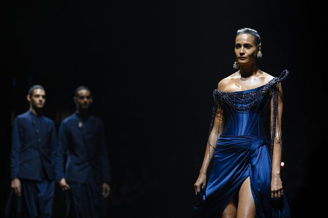 Models present creations by Indian designer Gaurav Gupta during the couture show in Mumbai on July 17, 2026. (Photo by Sujit JAISWAL / AFP)