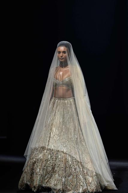A model presents a creation by Indian designer Gaurav Gupta during the couture show in Mumbai on July 17, 2026. (Photo by Sujit JAISWAL / AFP)