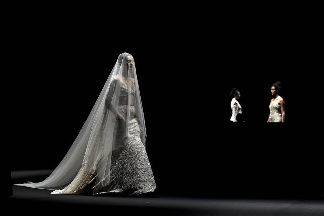Models present creations by Indian designer Gaurav Gupta during the couture show in Mumbai on July 17, 2026. (Photo by Sujit JAISWAL / AFP)
