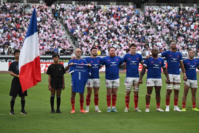 The French team stands for their national anthem ahead of their rugby union Nations Championship match against Japan at the National Stadium in Tokyo on July 18, 2026. (Photo by ANDREW CABALLERO-REYNOLDS / AFP)