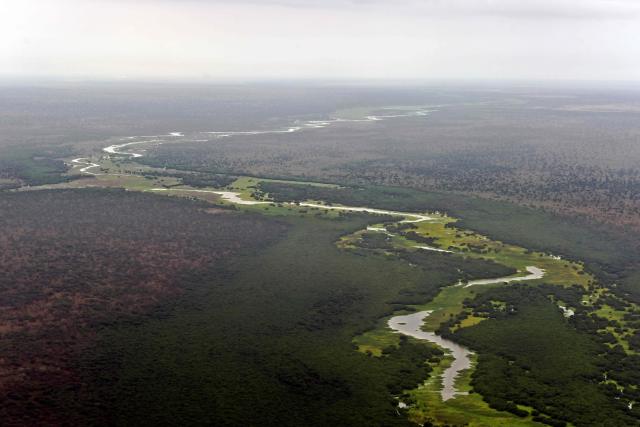 (FILES) An aerial view of the Pibor river flowing across the landscape between Boma and Badingilo national parks on February 4, 2020. The United Nations looks set to list a Biblical site, Lebanese castles, an antelope migration path and the world's deepest lake as world treasures under threat, including from war or climate change. The 196 members states of the United Nations Educational, Scientific and Cultural Organisation (UNESCO) are to cast votes from Friday next week on new additions to its World Heritage and World Heritage in Danger lists when they meet in Busan, South Korea. (Photo by TONY KARUMBA / AFP)