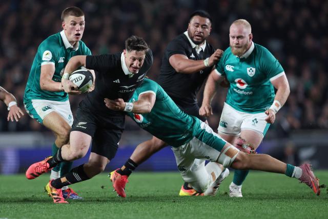 Cam Roigard of New Zealand is tackled during the rugby Nations Championship match between New Zealand and Ireland at Eden Park in Auckland on July 18, 2026. (Photo by Michael Bradley / AFP)