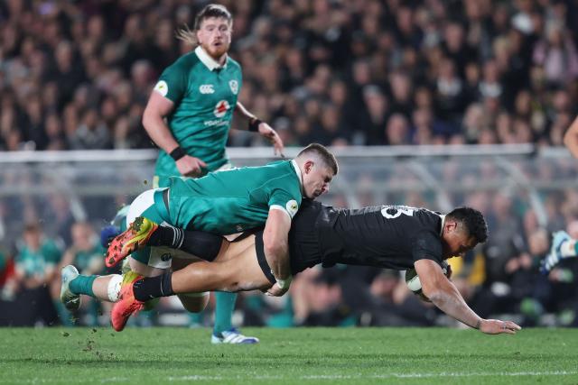 Caleb Clarke of New Zealand is tackled by Nick Timoney of Ireland during the rugby Nations Championship match between New Zealand and Ireland at Eden Park in Auckland on July 18, 2026. (Photo by Michael Bradley / AFP)